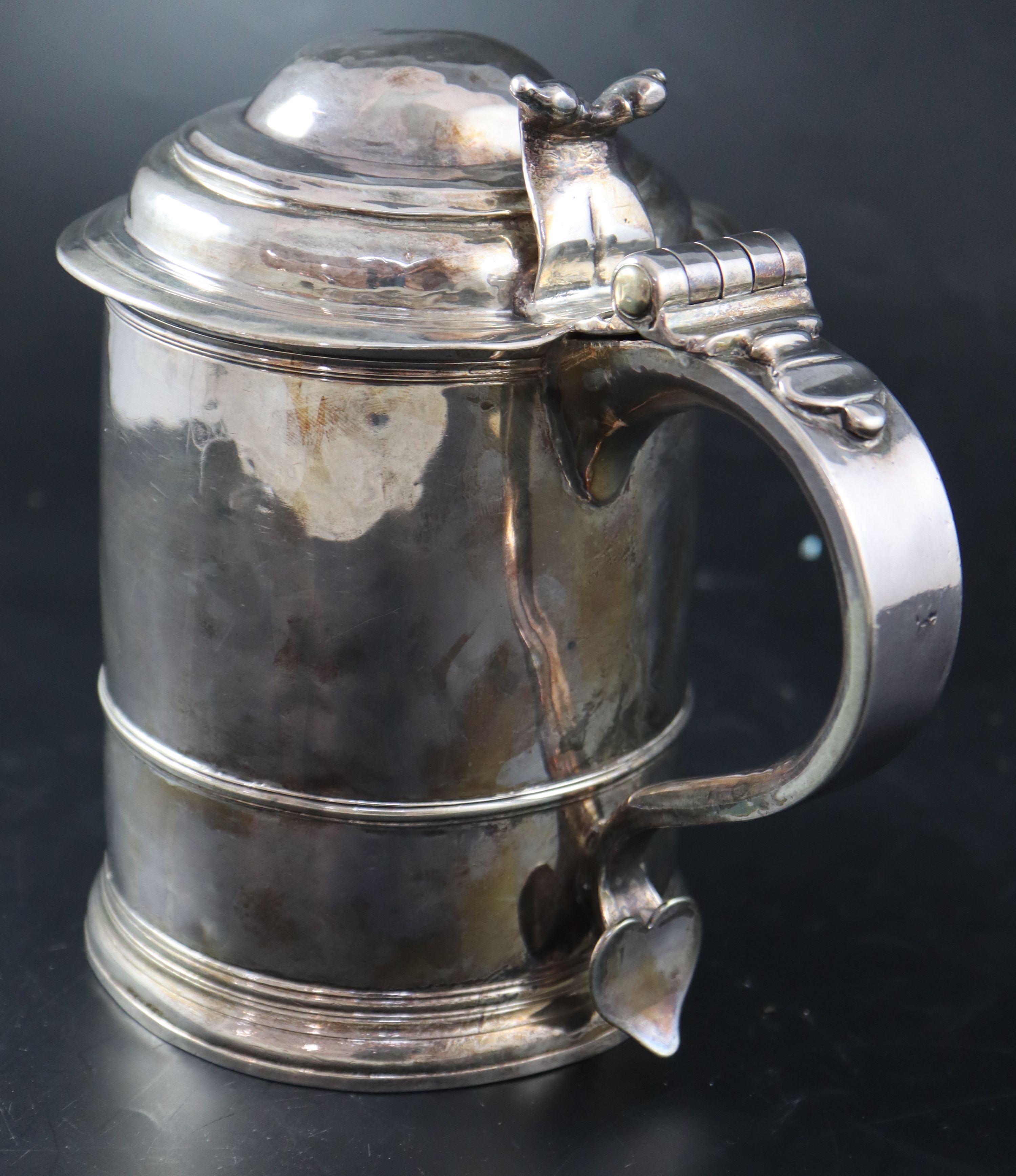 A late Queen Anne silver tankard, 17.4cm, 21.5oz (a.f.).